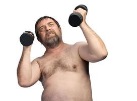 man exercising with dumbbells photo