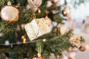 Christmas pine tree with decorative golden ball and bauble ornamental photo