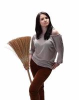 Young woman with a broom photo