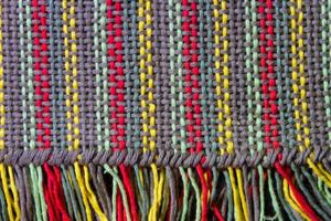 texture of multi-colored loom woven fabrics photo