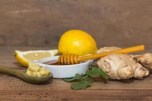composition of ginger lemon honey and fresh mint photo