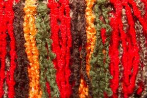 texture of wool fringes and colored threads photo