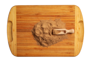Aromatic fragrant organic spice from cumin powder, on a wooden cutting board in a wooden spoon. png