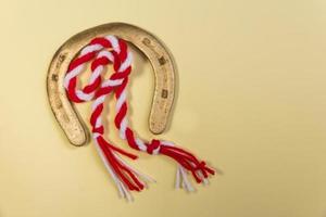 a golden horseshoe and a wool martisor photo