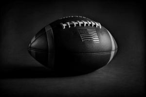 Close up of an American football on dark background. photo