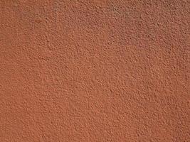 industrial style brown red plaster wall background photo