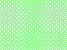 white polka dots over pale green background photo