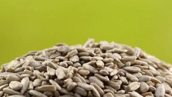 Rotation of peeled raw sunflower seeds. Studio shot. Healthy food, super seeds concept. Food background. Gastronomy concept, natural products. video