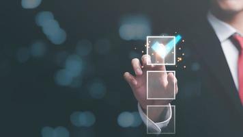 man check mark about exploring topics,In the virtual form check sheet,checklist ideas, checkbox to conduct opinion and quality surveys or satisfaction,Connect and work with modern wireless technology photo