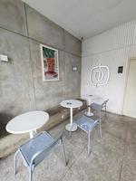 Jakarta, Indonesia in July 2022. The interior of the Fore cafe is dominated by concrete furniture photo
