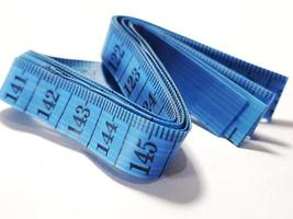 Isolated white photo of a sewing meter or fabric meter in blue.