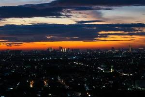 The skyline is a very beautiful sunset sky with an orange color in the sky that is getting dark photo