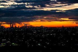 The skyline is a very beautiful sunset sky with an orange color in the sky that is getting dark photo