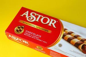 Jakarta, Indonesia in December 2022. Isolated photo of Astor Wafer Stick Chocolate on a yellow background.