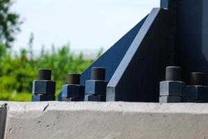 The blue bolts and nuts of the structure with large dimensions are made of high quality steel, high tensile steel. photo