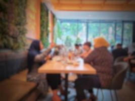 Blurred photo of atmosphere of the Solaria restaurant where many visitors are families eating together.