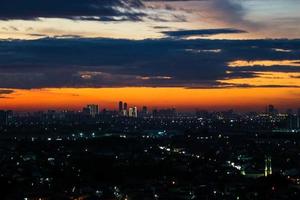 The skyline is a very beautiful sunset sky with an orange color in the sky that is getting dark photo