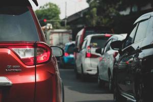 Close up photo of a back lamp of car that stuck in a traffic jam on the highway,