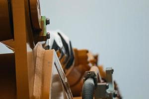 Close up detailed components of the yellow excavator photo