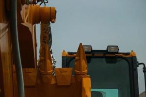 Close up detailed components of the yellow excavator photo