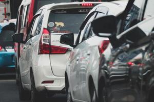 Close up photo of a back lamp of car that stuck in a traffic jam on the highway,