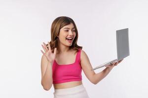 Portrait of young woman video call with laptop computer isolated over white background photo