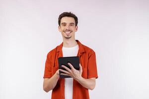 Portrait of attractive cheerful man using device app searching web isolated over white color background photo