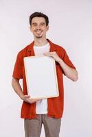 Portrait of happy man showing blank signboard on isolated white background photo