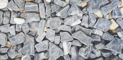 Pattern of gray gravel, rock or small stone for background. Hard material, Art wallpaper and Group of object concept photo