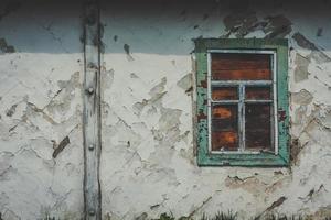 Close up abandoned building with flaky plaster walls concept photo