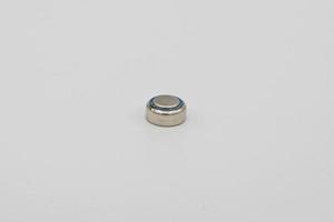 Button battery macro isolated on white photo