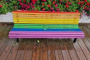 Rainbow flag bench after the rain in Valencia photo