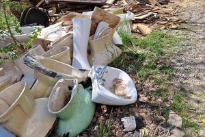 Many old abandoned ceramic toilet wc sinker photo