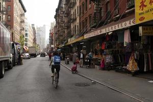 NEW YORK, USA - MAY 4 2019 - Chinatown streets markets and shops photo