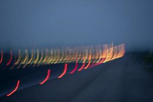 airport lights in motion while taking off at night photo