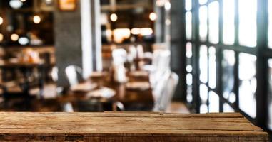 Empty top of wooden shelves on coffee shop ,tree front view background. For product display blur background image, for display montage. photo