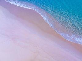 Top view of amazing pastel sand beach and turquoise sea copy space available nature background, High angle view sea sand background photo