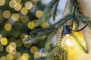 Christmas with fir tree and festive bokeh lighting, blurred holiday background photo