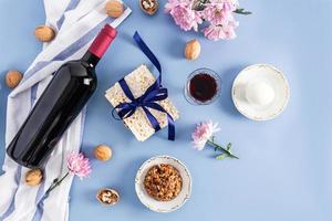 festive background of the Jewish Passover. traditional products and symbols of the holiday on a blue background. view from above. flat layout. photo