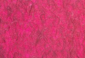 Red handmade paper or mulberry paper texture for background photo