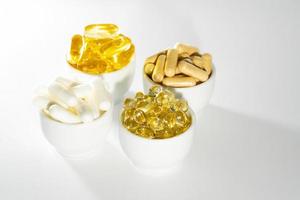Vitamin D, omega 3, omega 6, Food supplement oil filled fish oil, vitamin A, vitamin E, flaxseed oil. photo