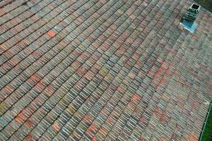 italiy tile roof chimney detail drone view photo