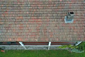 italiy tile roof chimney detail drone view photo