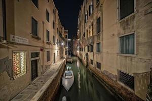 Venice Gondola tour at night photo