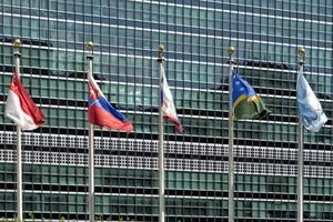 flags outside united nations building in new york photo