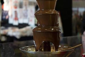 Chocolate fountain close up photo