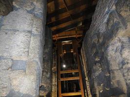 Winch reproduction inside Colosseum in Rome interior, view at night, 2022 photo