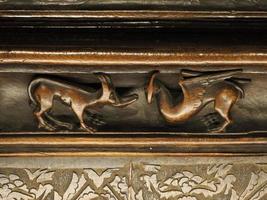 TOLEDO SPAIN - DECEMBER 16, 2022 Carved mahogany choir seats wooden sculpture in Cathedral of Toledo, Spain photo