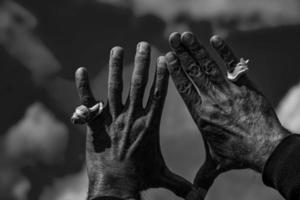 black man Hand with a shell in the sky photo