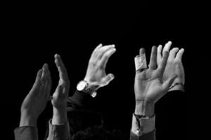 stop halt raised hands in black and white photo